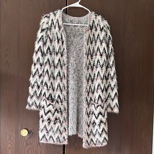 Absolutely Famous long sleeved white, black and pink long sweater. Size Medium.